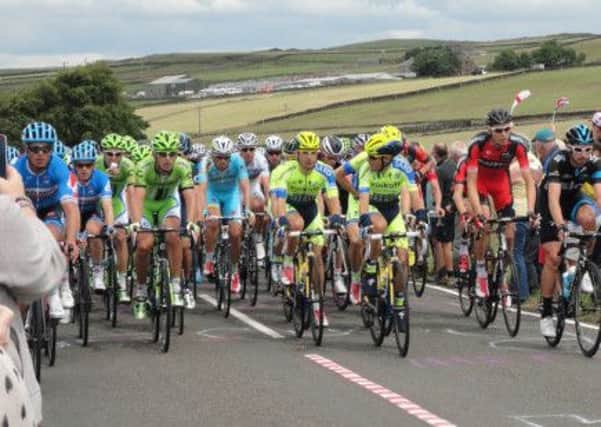 Courer reader Chris Buxton captured this picture of the Tour De France racers at Cragg Vale.