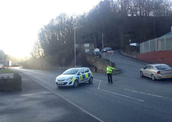 Police have closed  off Elland Road in Brighouse following a fatal  crash