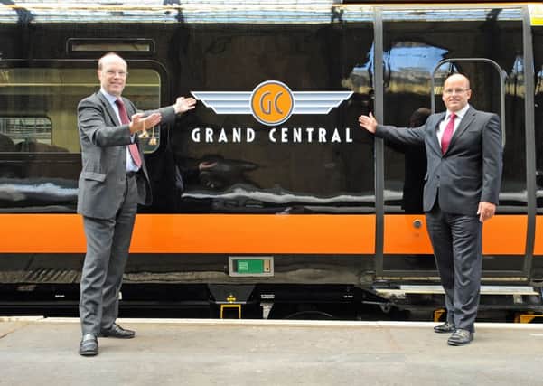 Grand Central Railway about the signing of a lease for three additional trains which will be used to operate the new West Riding service (linking Bradford Interchange, Halifax, Brighouse, Wakefield, Pontefract, Doncaster and London Kings Cross - Giles Fearnley, Chairman of Grand Central and Kevin Tribley Commerical Director of Angel Trains celebrating after the lease had been signed.