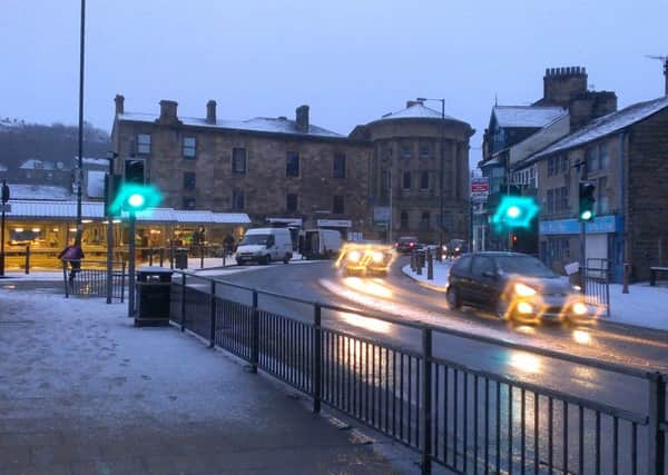 Traffic trails through the snow in Todmorden town centre