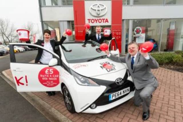 Vantage Toyota in Knaresborough are doing it for Red Nose Day 2015: (l to r) Cheryl Coxhill, Mark Pierce and Jon Banner. (S)