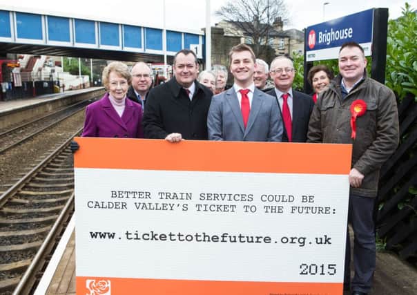 Shadow Transport Secretary Michael Dugher MP with Labourâ¬"s parliamentary candidate for Calder Valley, Josh Fenton-Glynn and a group of local campaigners at Brighouse station on Friday