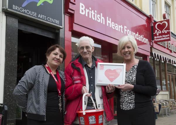 Manager Irina Jacklim, left, and area manager Mechelle Hopkins, right, with volunteer Jonathan Wilson Brighouse British Heart Foundation shop