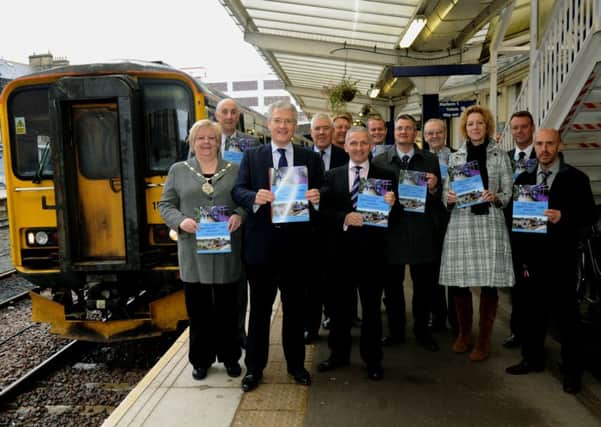 11/10/13   Andrew Jones MP (3rd left)  with other stakeholders  at the official launch of Harrogate rail line improvement bid at Harrogate  station on 2013 .