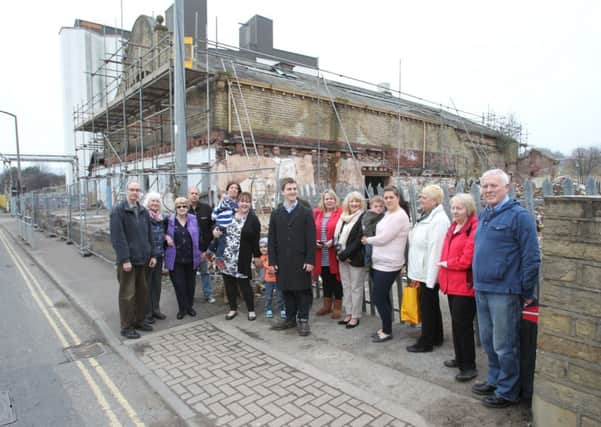 Campaigners gather outside the former Brighouse Swimming Baths site.