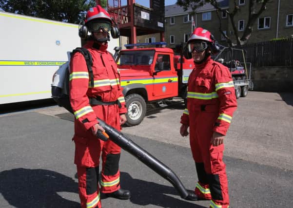 Todmorden fire fighters Craig Hartley and Yannis Kiriakos with new moorland fire fighting equipment.