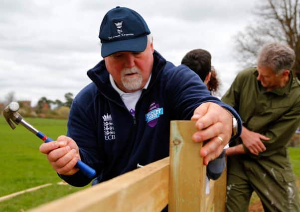 NEWPORT, ENGLAND - APRIL 04: Ex England cricket player Mike Gatting undertakes renovation work of a fence during the NatWest CricketForce at Forton Cricket Club on April 4, 2014 in Newton, England. (Photo by Paul Thomas/Getty Images for ECB)