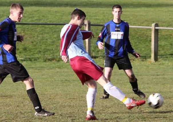 Craig Gladwin of Lee Mount gets in a shot during his side's Halifax Sunday Cup quarter final defeat by Carrington