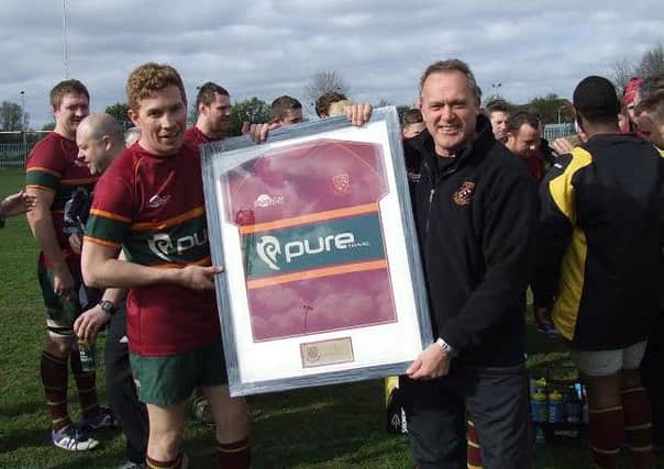 Kevin Plant reires as Heath coach. He receives a framed first team shirt from Si Brown