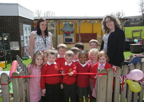 Anna Ayrton and Caroline Buchanan with children at Castlefield School,m Rastrick and their new play area.
