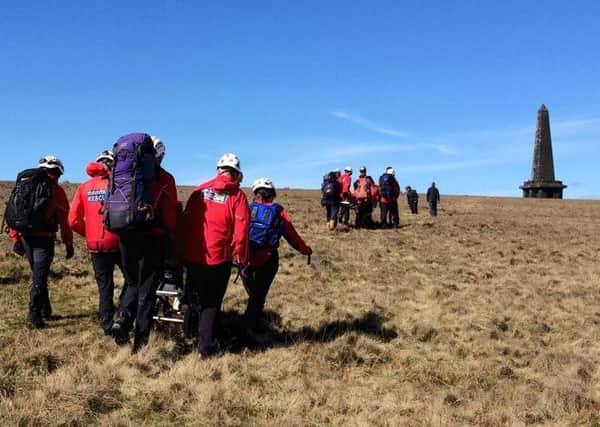 Calder Valley Search and Rescue Team transport disabled brothers Andrew and Nathan to the top of Stoodley Pike, Todmorden