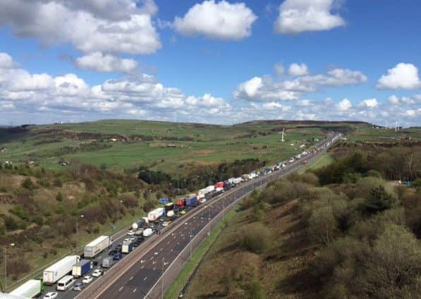 Queues on the M62 viewed from Scammanden Bridge. The outside lanes in both directions are closed between junction 22 (Rishworth Moor) and junction 24 (Ainley Top) following a crash involving two HGVs