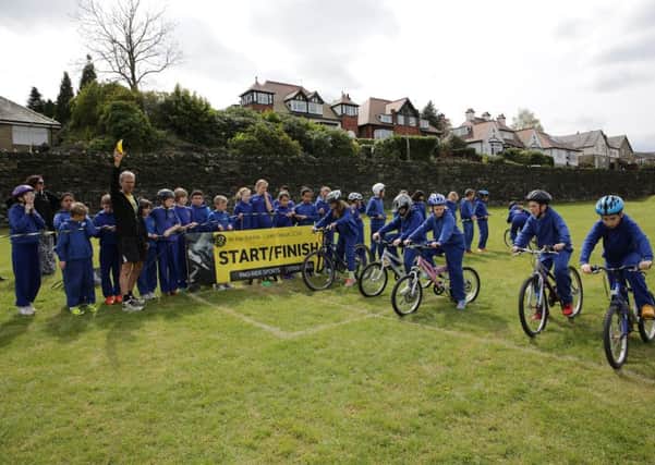Olympic cyclist Phil Bateman runs a bike racing competition at St Chad's School, Hove Edge.