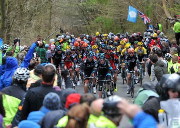 TOUR DE YORKSHIRE 2015 --- Dalby Forest Section on Stage 1 of the first Tour De Yorkshire bike race. // Riders and spectators on the Cote de Dalby. Friday 1st May 2015. HARRY ATKINSON REF: