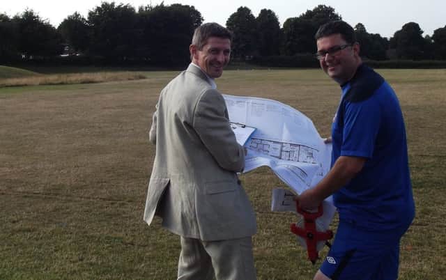 Rastrick Junior Football Club has just got planning permission. Pictured are Jeremy Meadowcroft (Ground development Officer) & Dave Evans (Vice-chairman) look over their plans/drawings with smiles.