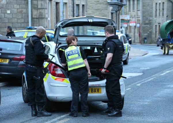 Armed officers were called to Burnley Road, Cornholme, to reports that a man was walking around with a Samurai sword. Photo by David Curley