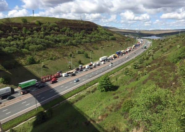 Traffic on the M62 following an accident  between junction 21 (Milnrow) and 22 (Ripponden) is backed up beyond Scammonden Bridge, Halifax. Photo by Charles Round