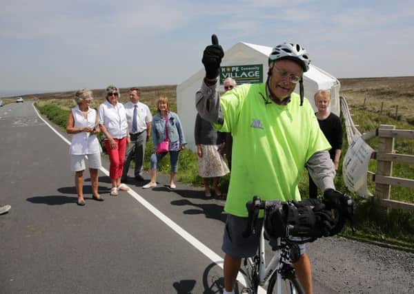 Roger Haley makes his 365 cycle climb of Cragg Vale.