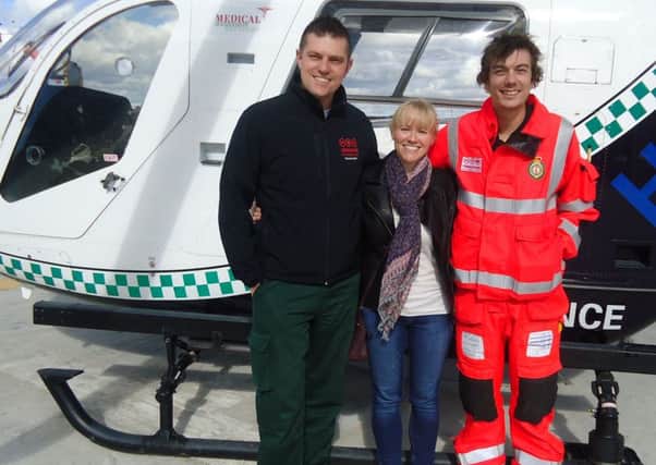 Hayley Morris from Wyke meeting Yorkshire Air Ambulance paramedics Leon Baranowski and Matt Syrat.