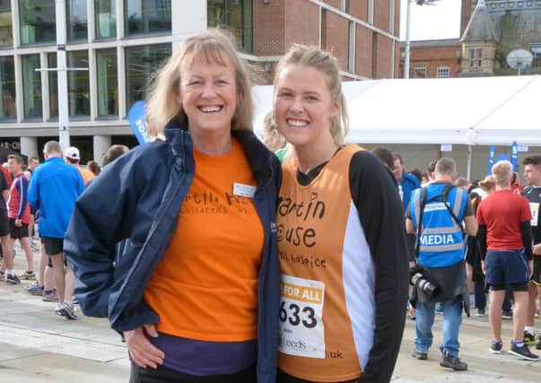 Alyson Wort stands with her daughter Daisy before the 2014 Leeds Marathon, running for Martin House Charity