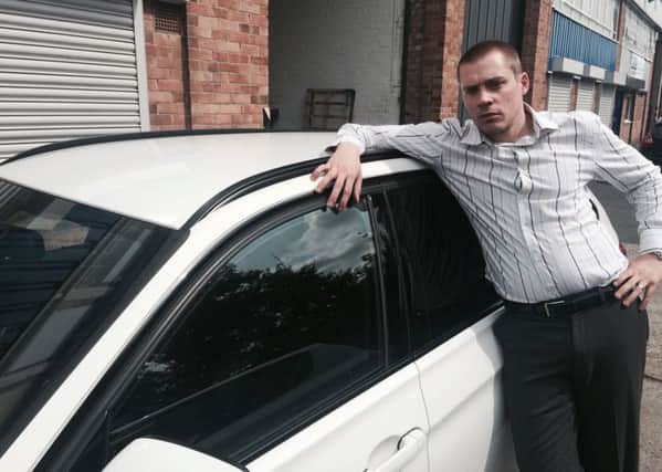 Gary Hickey with his BMW which was damaged by huge hailstones