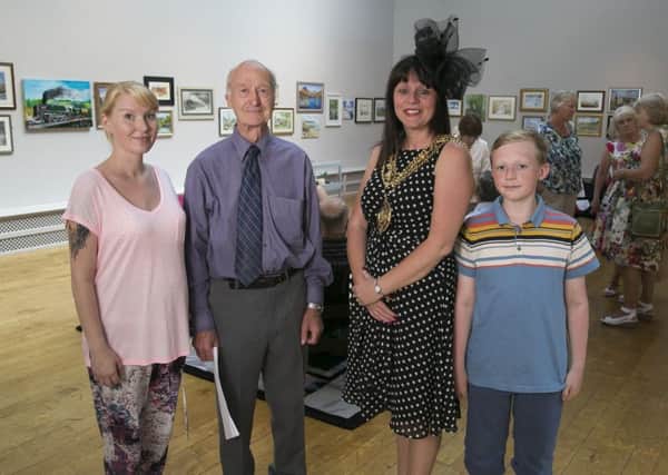 Opening of the Brighouse Art Circle Annual Exhibition at Smith Art Gallery. From the left, exhibition organiser Heidi Farrell, chairman Geoff Habergham, Mayor of Calderdale councillor Lisa Lambert and Harvey Teal, 11.