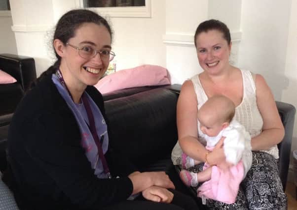 Jenny Oldroyd, with new mum Laura McCarthy and daughter Ada