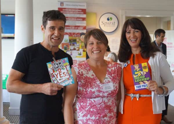 Author Tom Palmer, Rachel Kelly, chief executive of Reading Matters, and author Liz Pichon.