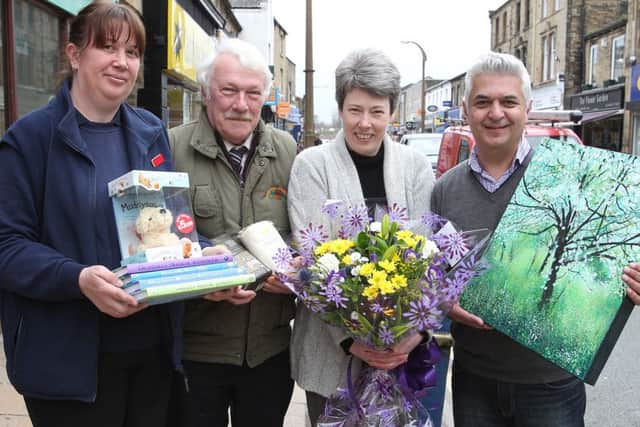 Brighouse traders  Anne Colley, John Buxton, Lesley Adams and Steven Lord prepare from Saturdays street market.
