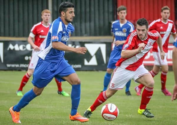 Harrogate Railway's Vincent Dhesi charges forward against Middlesbrough U21s (Photo: Caught Light Photography)
