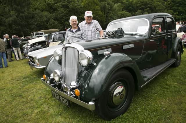 Sunday at Hebden Bridge Vintage Car Weekend, Calder Holmes Park. Eileen and Roy Sutcliffe with their Rover 16 sport saloon.