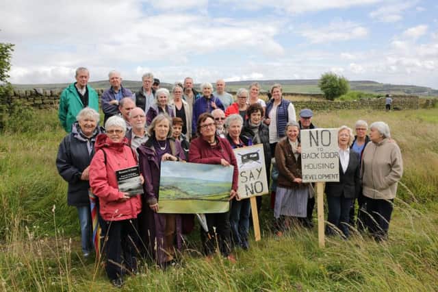 Coun Janet Battye with protesters against the proposed caravan site at Heptonstall.