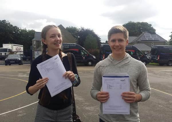 Hipperholme Grammar School students Theo Redfern and Eve Stollery celebrating their GCSE results.