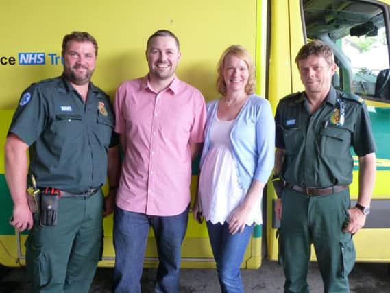 Lizzie Hughes stands with her husband Alastair and two paramedics after he was saved by a public access defibrillator when he suffered sudden cardiac arrest (NADV-21-08-15 WEB)