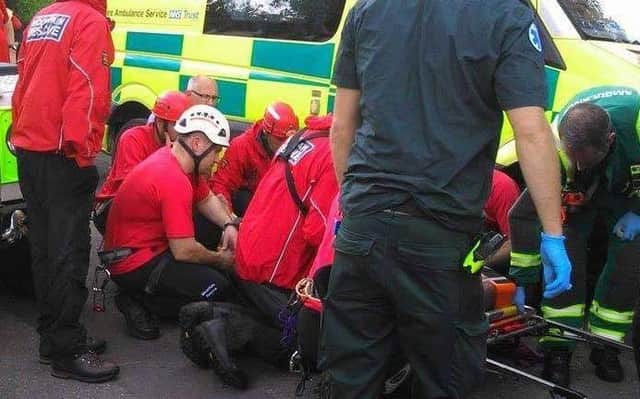 Calder Valley Search and Rescue Team help an injured walker in Denholme.