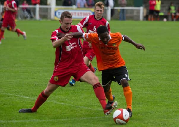 Actions from the game, Brighouse Town FC v Prescot Cables, at St Giles Road. Pictured is Leon Henry