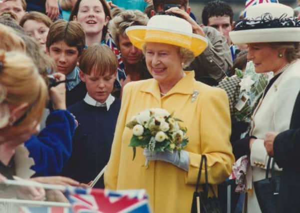Then and now: The crowds turn out for The Queen