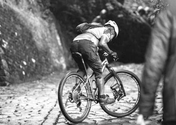Inching the way there - a cyclist tackling the Buttress, Hebden Bridge, challenge. Picture: Bruce Cutts