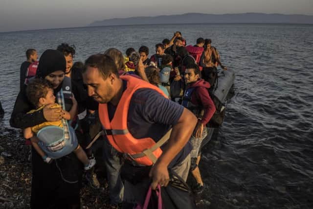 A group of Syrians, Afghans and Palestinians has just arrived to the coast of Lesvos. Greece, September 7, 2015. Photo by Anna Pantelia/Depo Photos/ABACAPRESS.COM ... Refugees Arrives In Lesvos Island - Greece ... 08-09-2015 ... Lesvos Island ... Greece ... Photo credit should read: Depo Photos/ABACA. Unique Reference No. 24028309 ...
