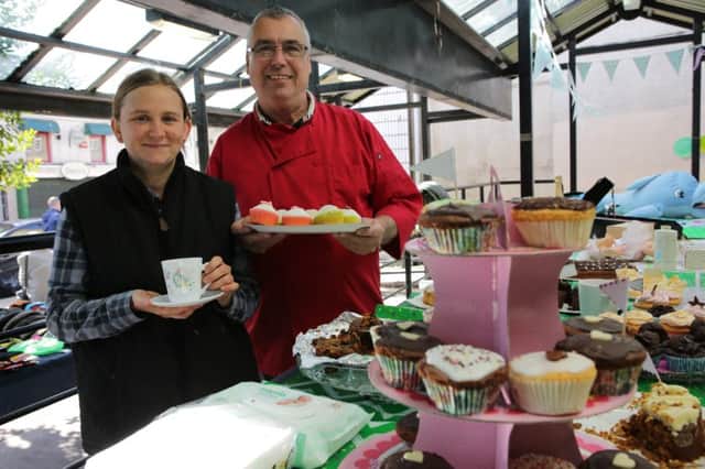 Macmillan coffee morning at Sowerby Bridge Market.  Natalie Heaton and Dennis Waddington.