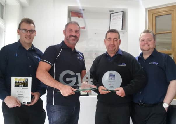 Sales and marketing director Tom Swallow, chairman Adrian Barraclough, managing director Michael Connor and business development director Ben Weber of Quick Slide with their recent awards, including best window  at the Build-It Awards.