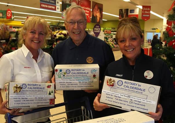 Angie Gallagher, Bryan Harkness and Bev Greenwood with Rotary Club and Courier shoebox appeal at Tesco, King Cross.