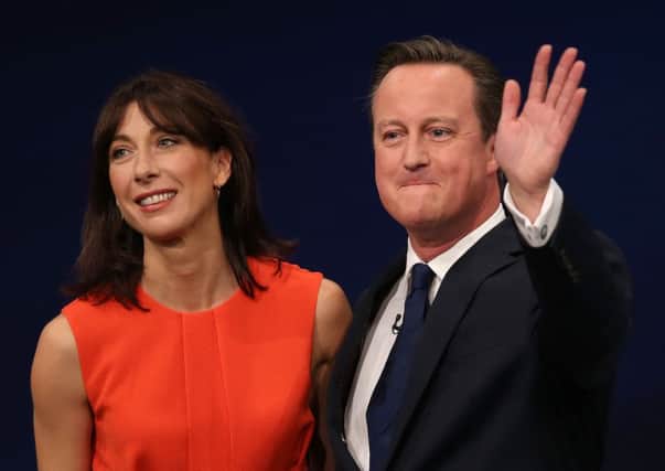 Prime Minister David Cameron on stage with wife Samantha after his address to the Conservative Party conference at Manchester Central. Peter Byrne/PA Wire
