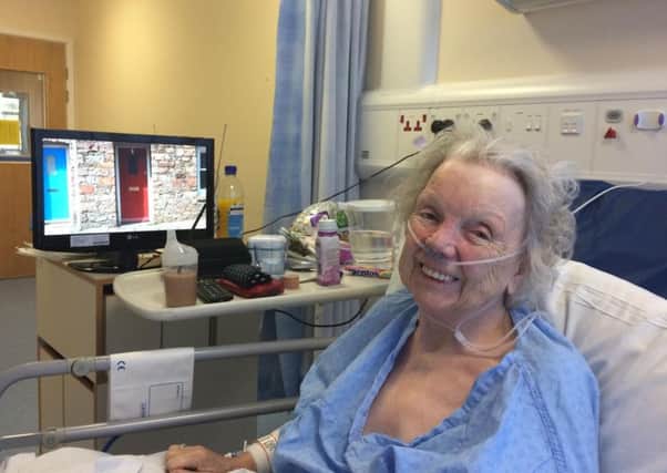 NAKP-15-10-15-003 Rose Smiles sits in hospital still chirpy after her incident