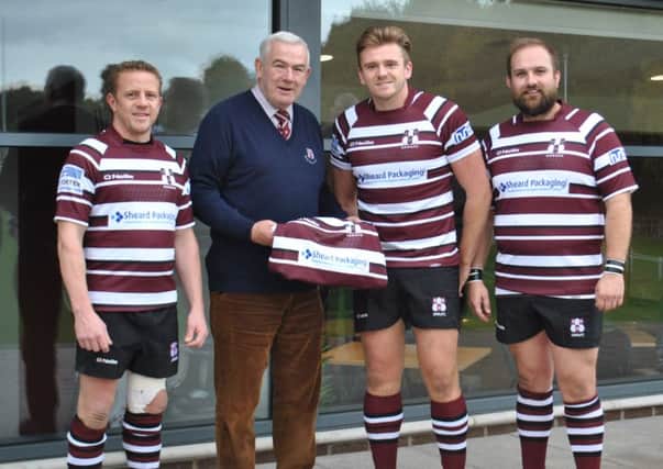 Chairman of Sheard Packaging John Whittaker hands over the new strip to Old Rishworthians captain Fraser Swarbrooke, with club record points scorer Aaron Canning (left) and player-coach Chris Stone (right).