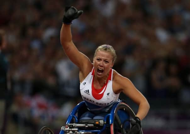 Great Britain's Hannah Cockroft celebrates winning Gold during the Women's 200m - T34 Final at the Olympic Stadium, London. PRESS ASSOCIATION Photo. Picture date: Thursday September 6, 2012. See PA story PARALYMPICS Athletics. Photo credit should read: Lynne Cameron/PA Wire