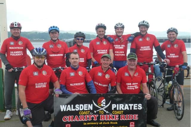 The team of Todmorden cyclists, mainly former Walsden Pirates FC footballers, who completed a coast-to-coast challenge, raising more than £6,000 for the British Heart Foundation in memory of team-mate - and previous particpant in fundraising rides - Jack Hook. Here at the start of the ride at Arnside, Lancashire