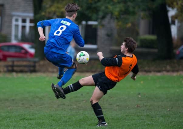 Actions from Shelf FC v Brighouse Sports, football, at Lane Head. Pictured is Jonny Aaron and Luke Heffernan