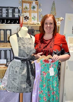 Phillipa Smith, owner of Fine Fettle, in her Cheltenham Crescent shop with a selection of stock. (S)