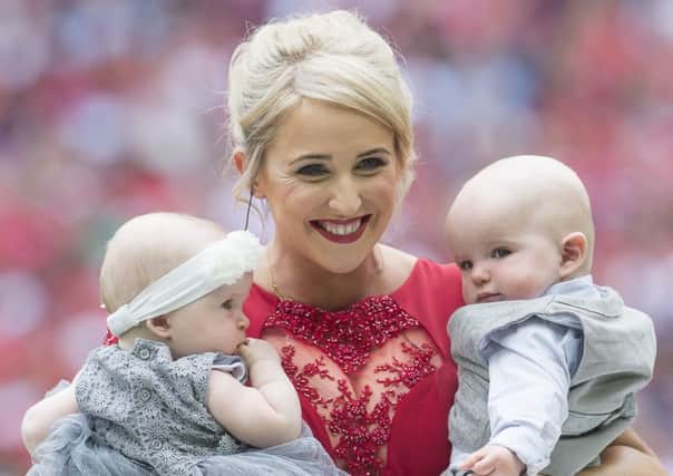 Picture by Allan McKenzie/SWpix.com Lizzie Jones leaves the field with her two babies after singing 'Abide with Me' in front of the crowd at Wembley.